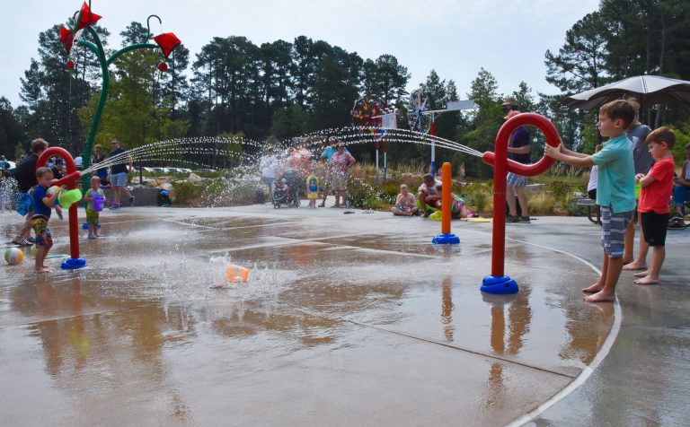 kids playing at the splash pad